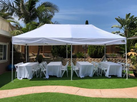 10x20 Canopy, 4 6ft tables, 24 Resin Chairs, and 4 linen